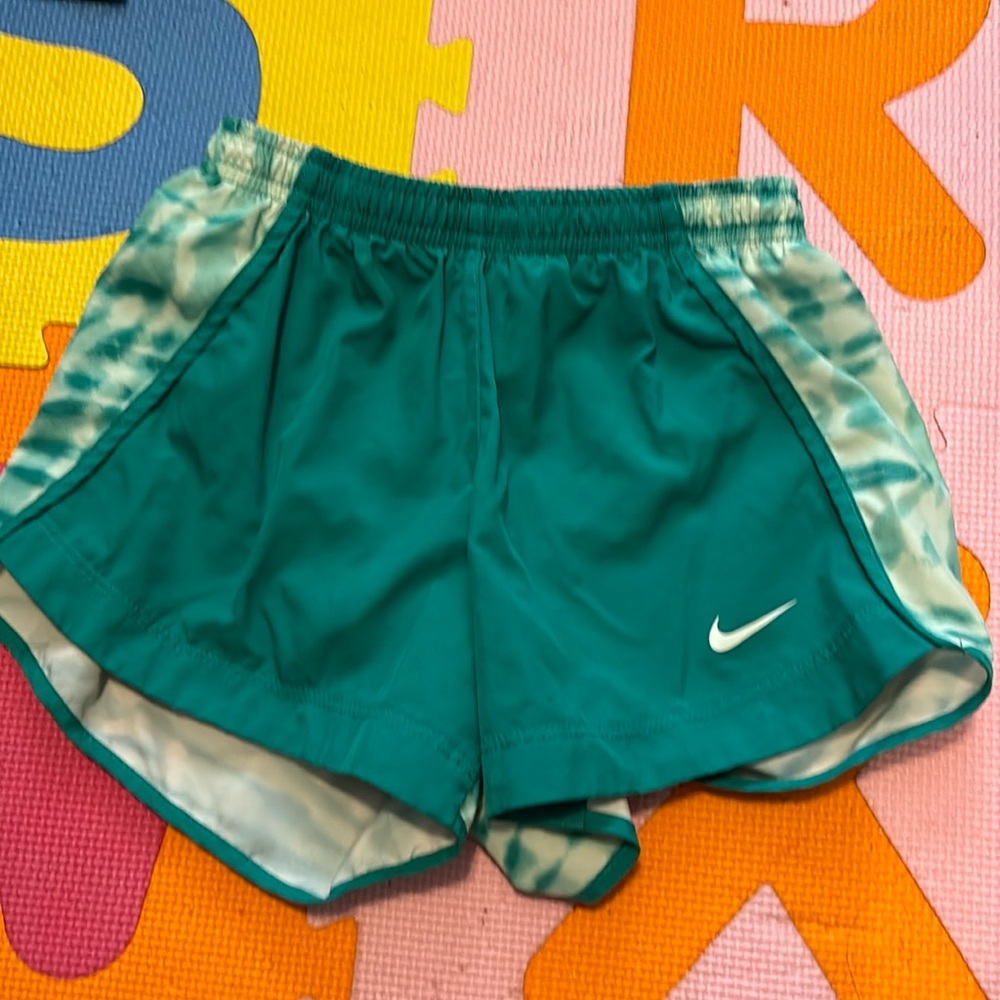 green nike shorts